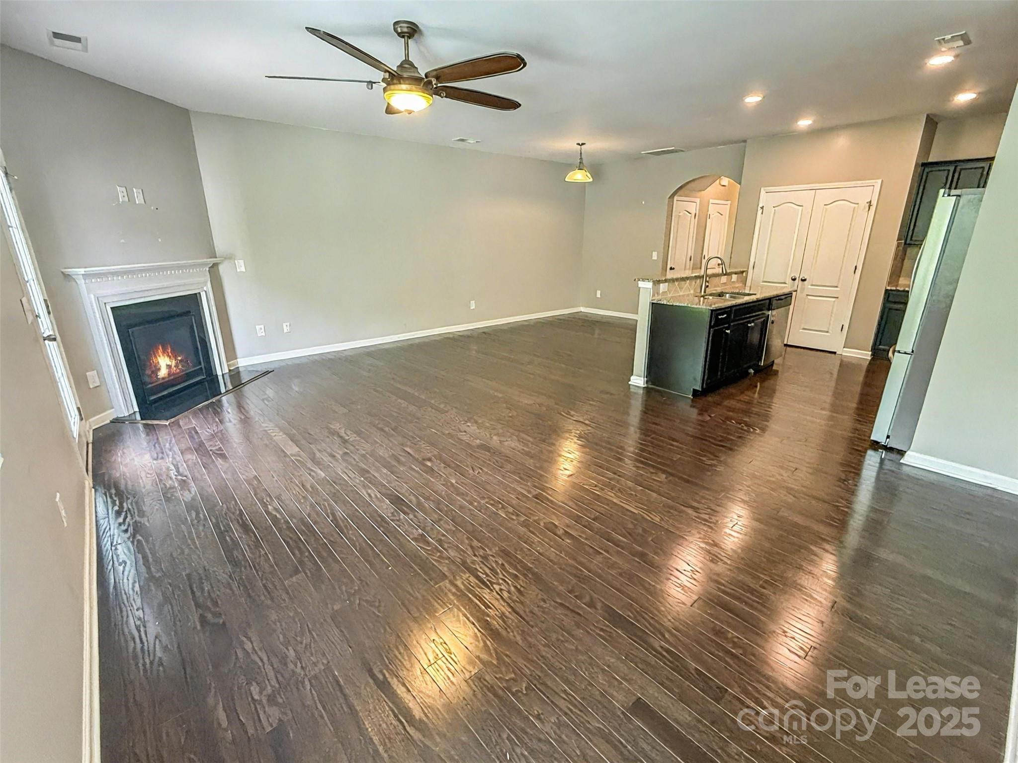 2752 Sawbridge Lane Gastonia, NC 28056 - Photo 7 of 25 a view of empty room with wooden floor and fan