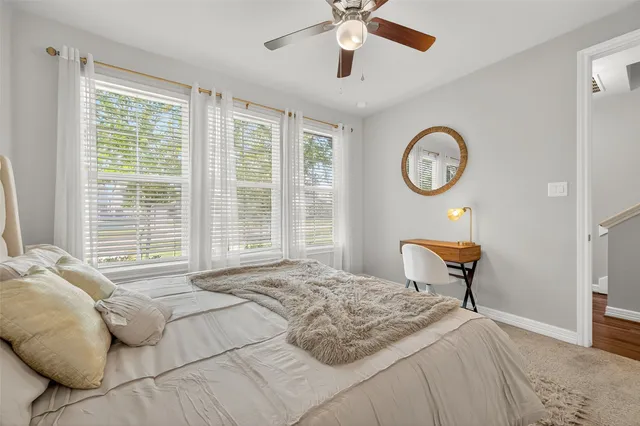 a bedroom with a bed and a chair