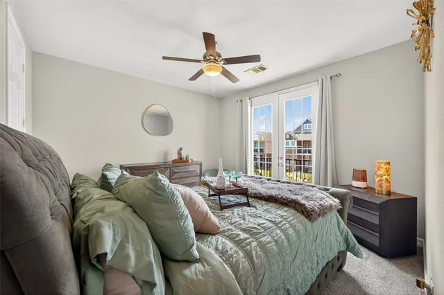 a bedroom with a bed and window