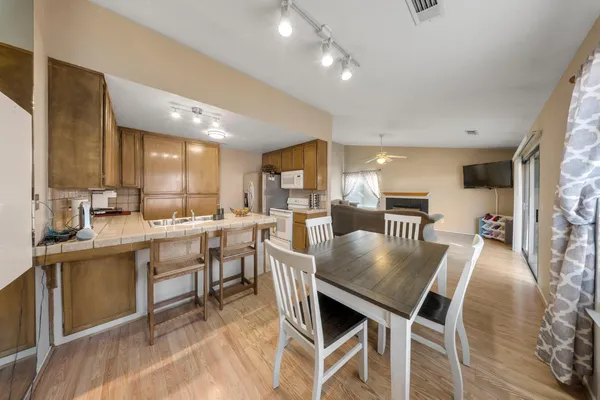 a bedroom with two beds and a chandelier