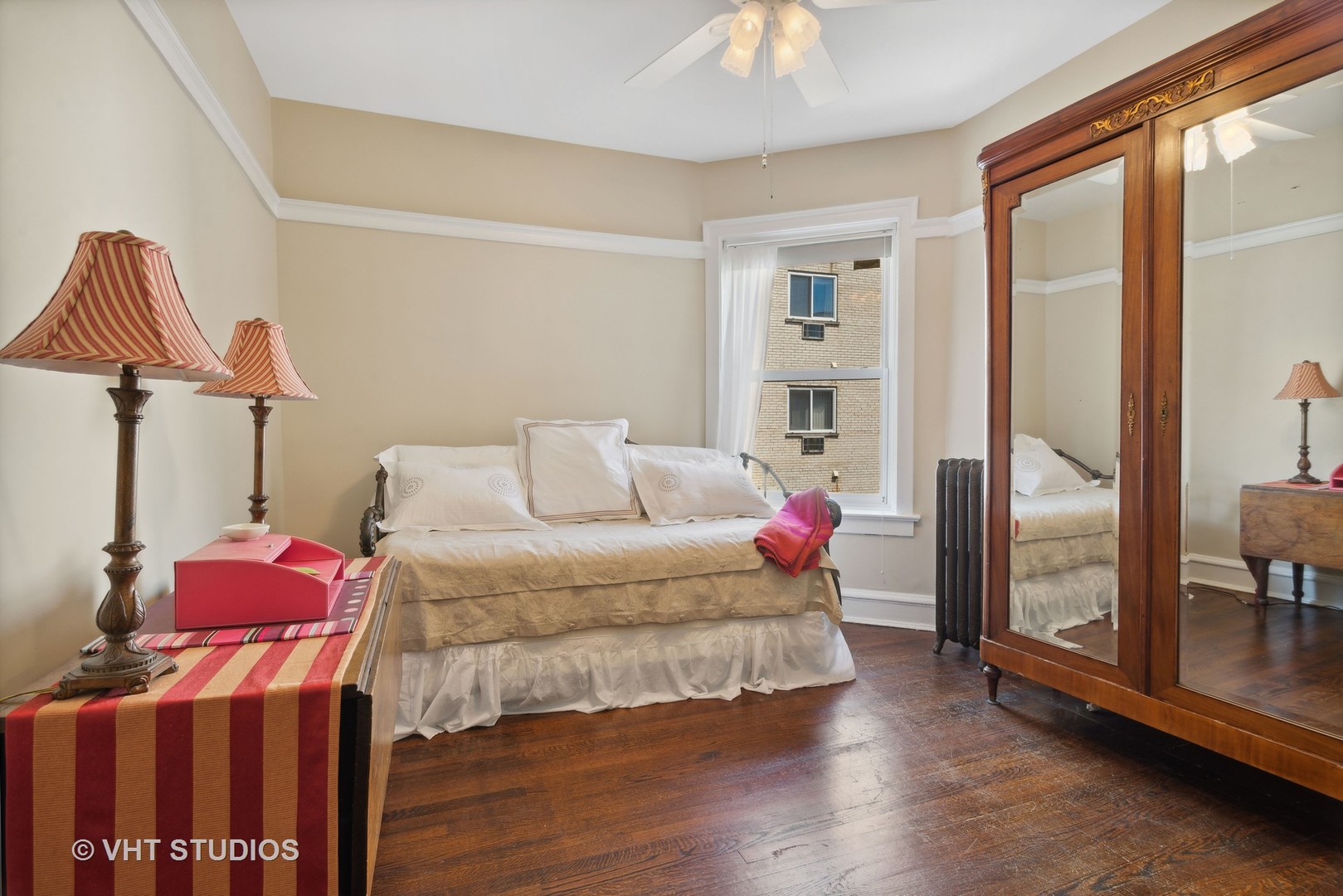 3755 North Pine Grove Avenue, Unit 2 Chicago, IL 60613 - Photo 12 of 17 a living room with furniture a window and a chandelier