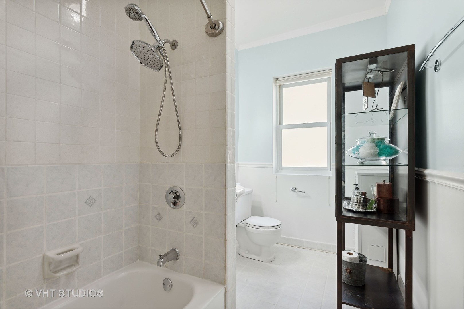 3755 North Pine Grove Avenue, Unit 2 Chicago, IL 60613 - Photo 13 of 17 a bathroom with a granite countertop sink a toilet and shower