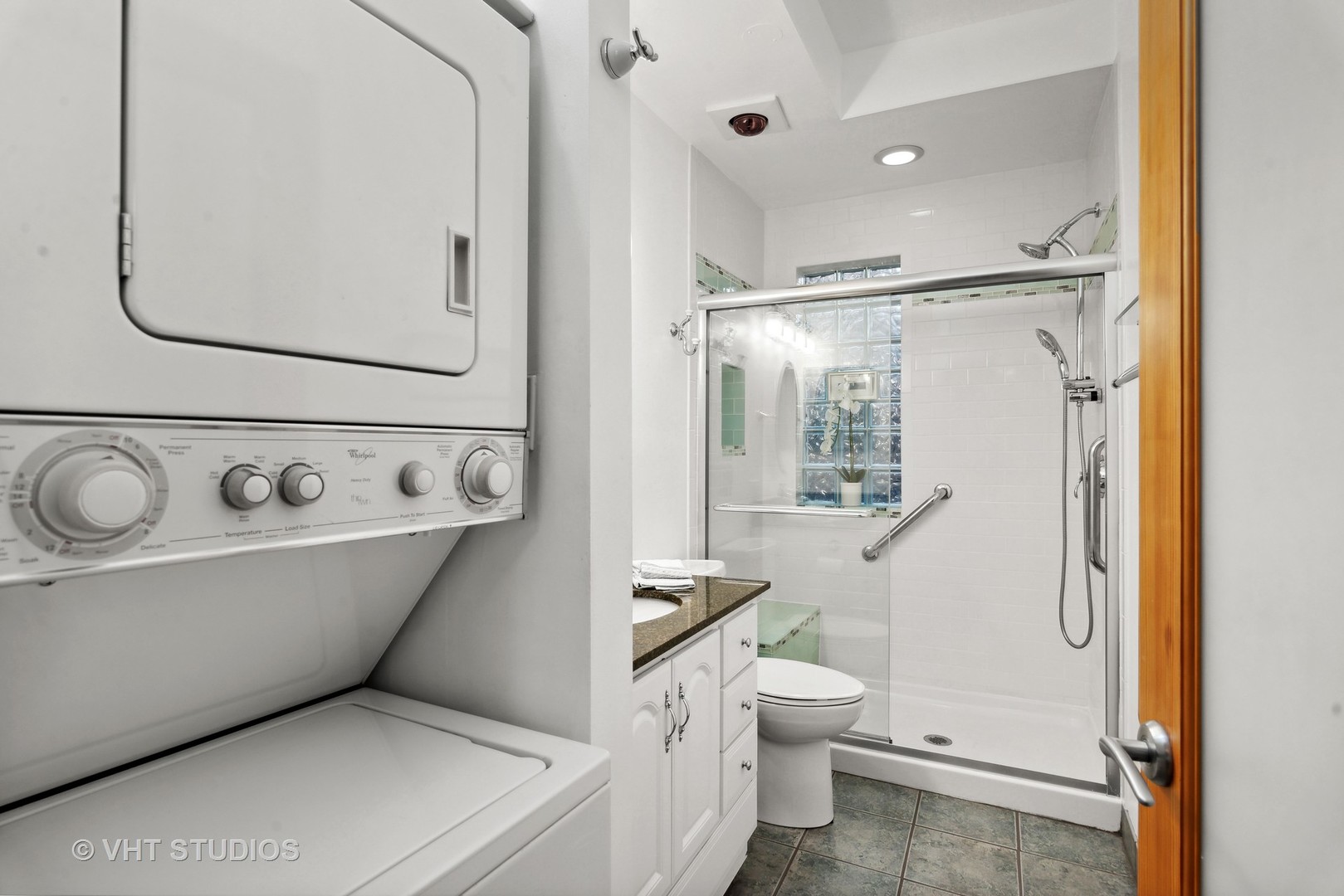 3755 North Pine Grove Avenue, Unit 2 Chicago, IL 60613 - Photo 15 of 17 a bathroom with a granite countertop sink toilet and shower