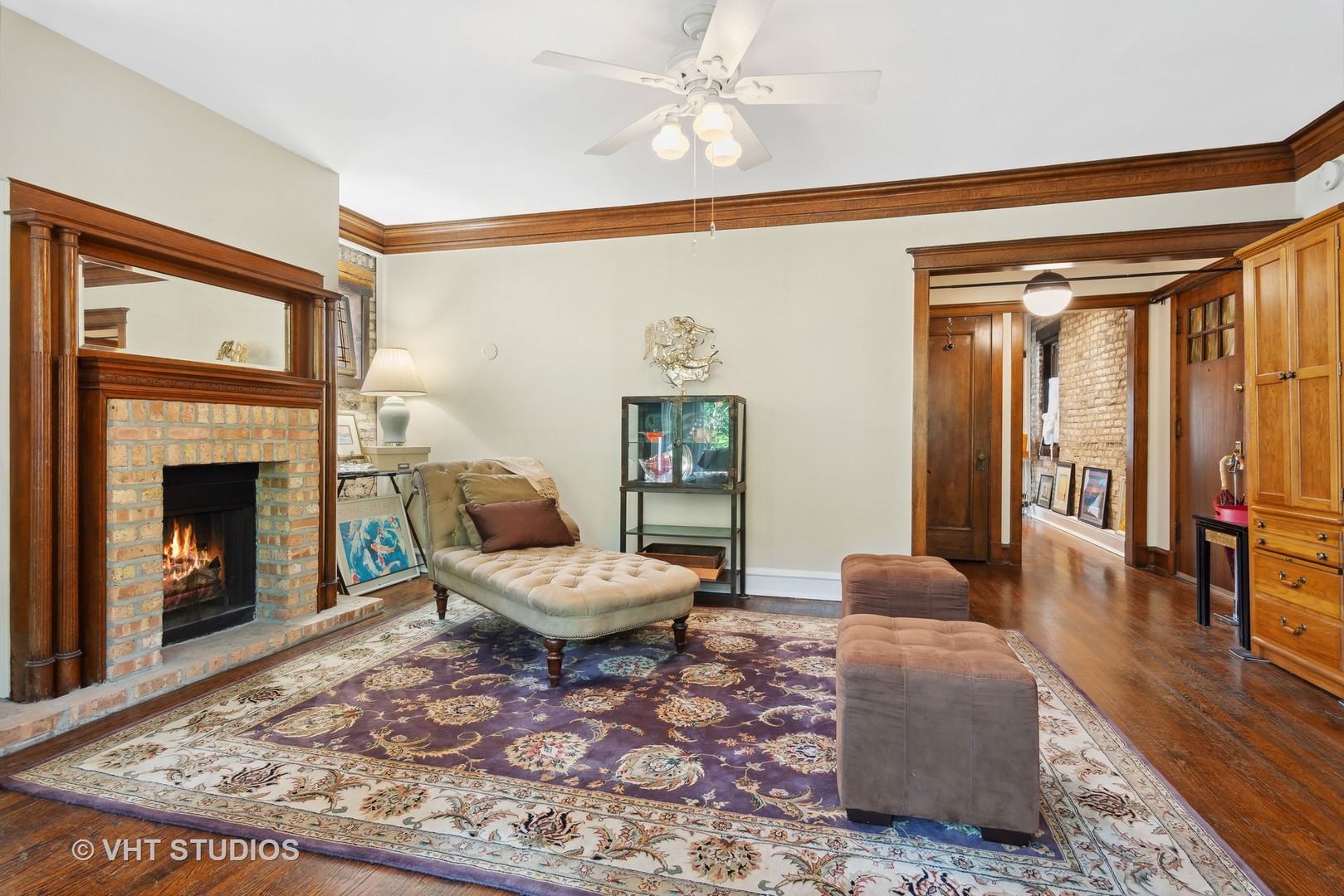 3755 North Pine Grove Avenue, Unit 2 Chicago, IL 60613 - Photo 4 of 17 a living room with furniture and a fireplace