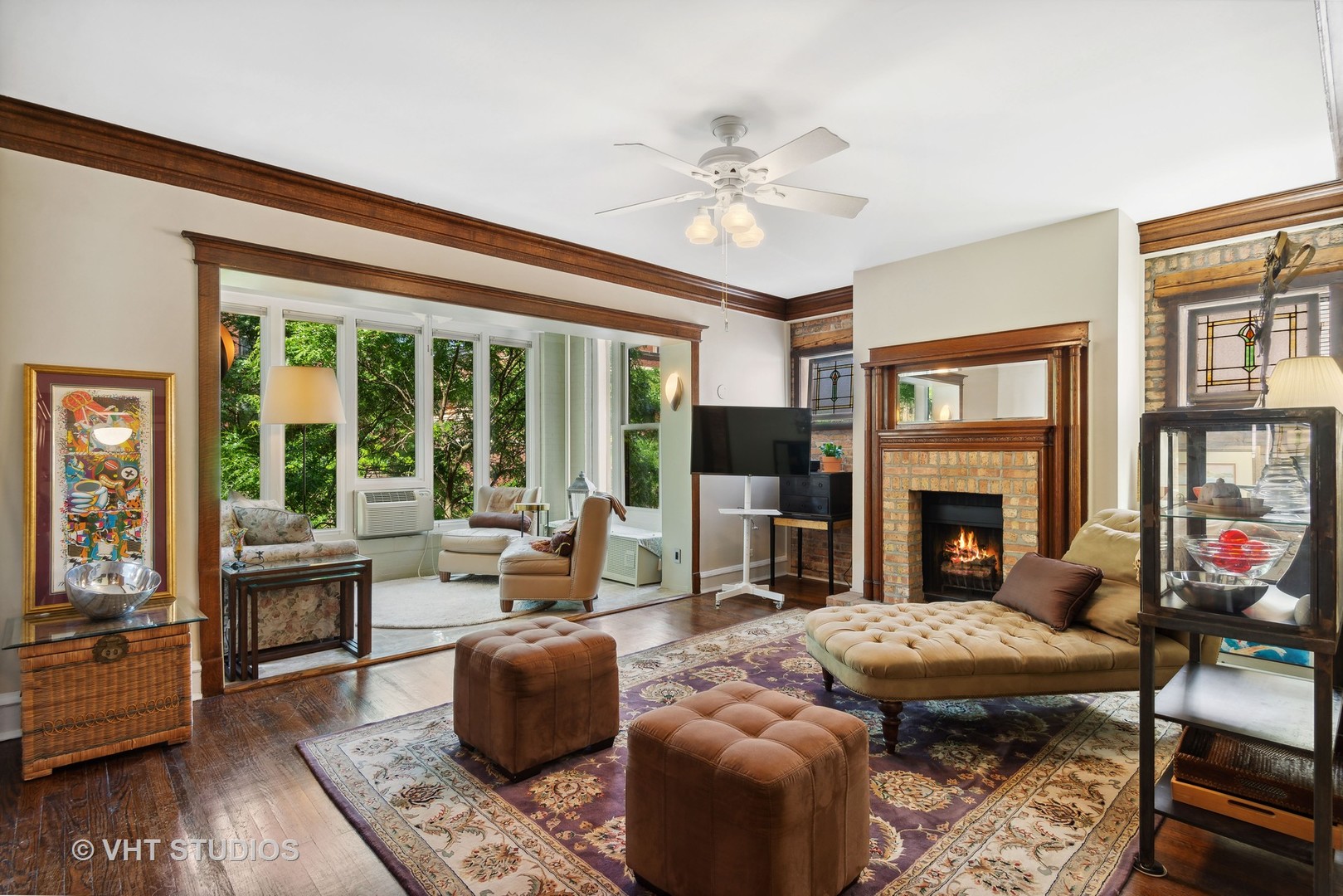 3755 North Pine Grove Avenue, Unit 2 Chicago, IL 60613 - Photo 5 of 17 a living room with furniture a fireplace and a flat screen tv