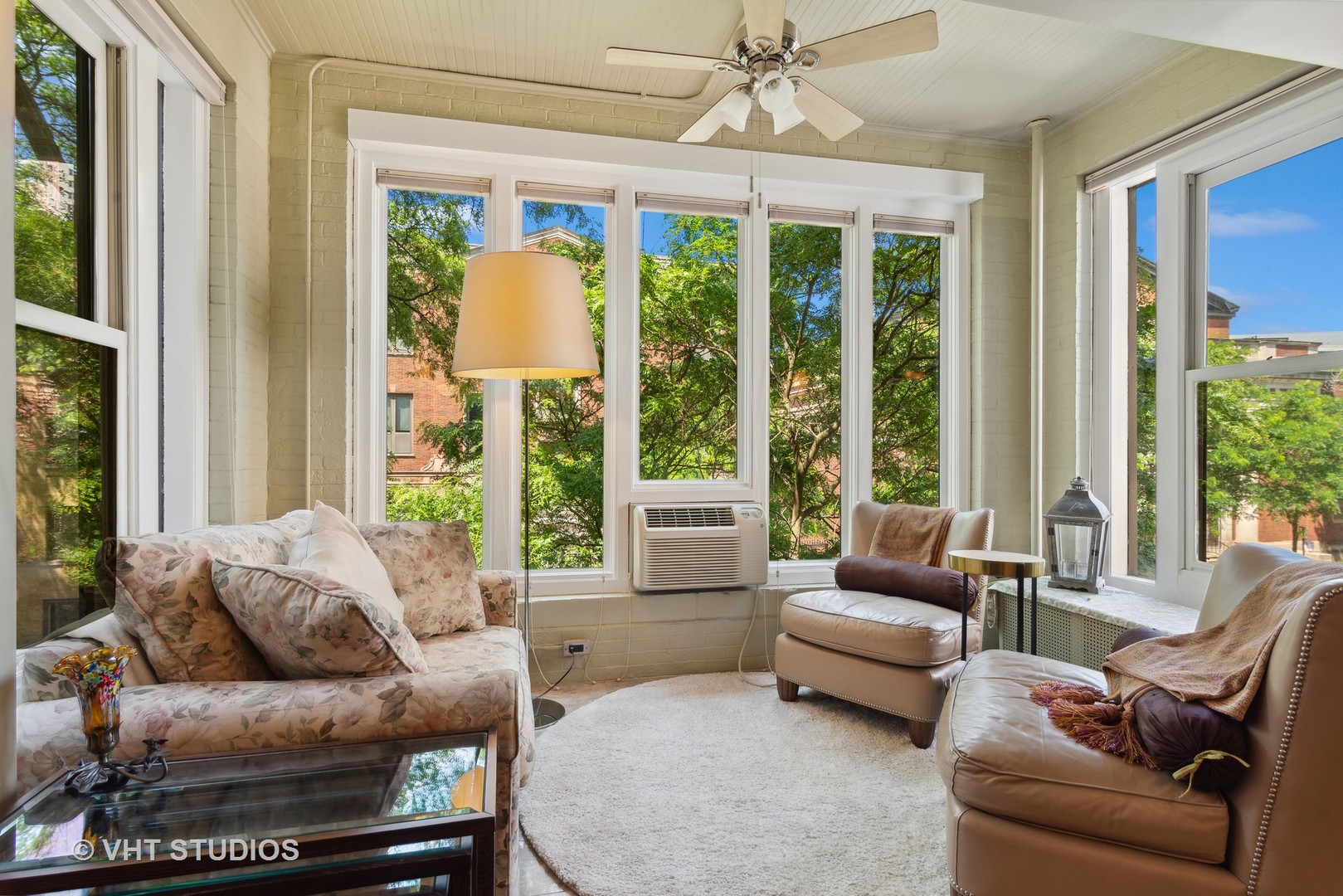 3755 North Pine Grove Avenue, Unit 2 Chicago, IL 60613 - Photo 6 of 17 a living room with furniture and a large window