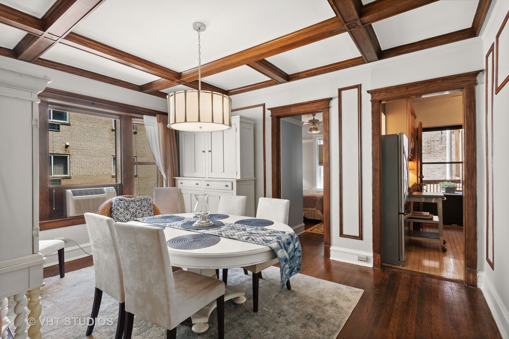 3755 North Pine Grove Avenue, Unit 2 Chicago, IL 60613 - Photo 9 of 17 a view of a dining room with furniture window and wooden floor