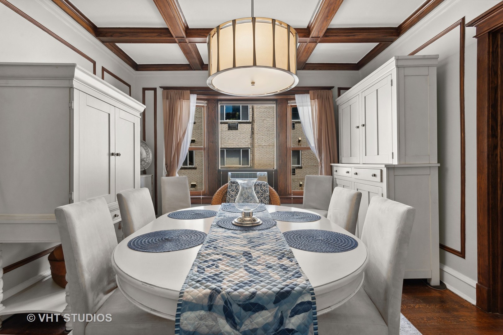 3755 North Pine Grove Avenue, Unit 2 Chicago, IL 60613 - Photo 10 of 17 a view of a dining room with furniture window and wooden floor