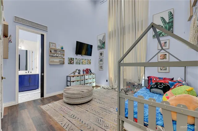 a bedroom with furniture and a book shelf