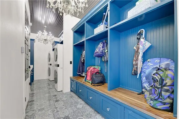 a view of a hallway with washer and dryer