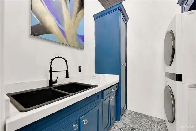 a close view of a sink a washer and dryer