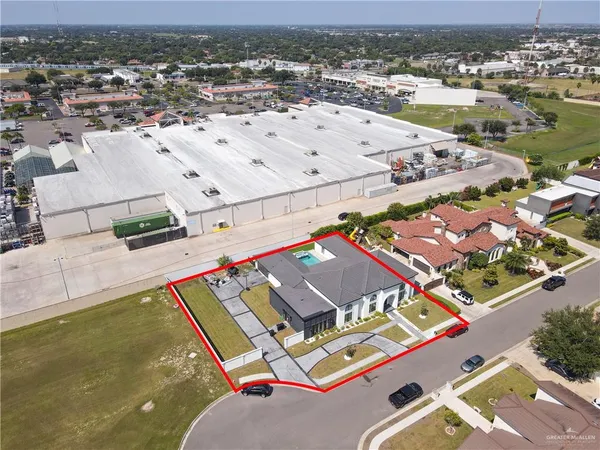 an aerial view of residential houses with outdoor space
