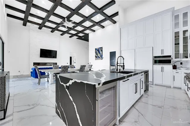 a open kitchen with stainless steel appliances granite countertop a sink counter space cabinets and a sink