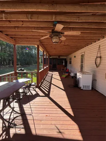 a view of walk in closet with clothes