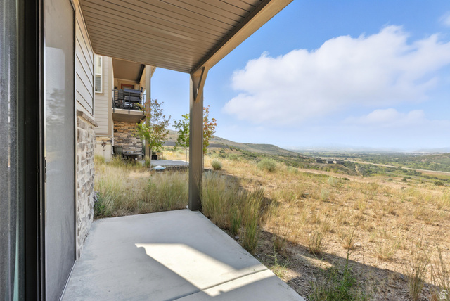 6039 North Westridge Road Heber City, UT 84032 - Photo 19 of 22 Covered concrete patio opening to natural landscape