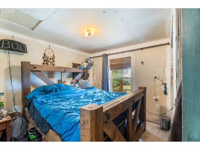 a bathroom with a granite countertop sink a mirror and a shower