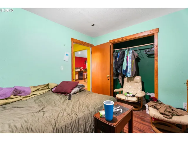 a bed room with a bed window and a television