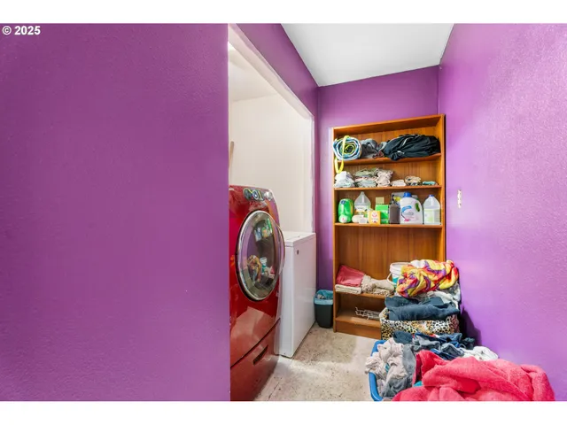 a dining room with a table and chairs