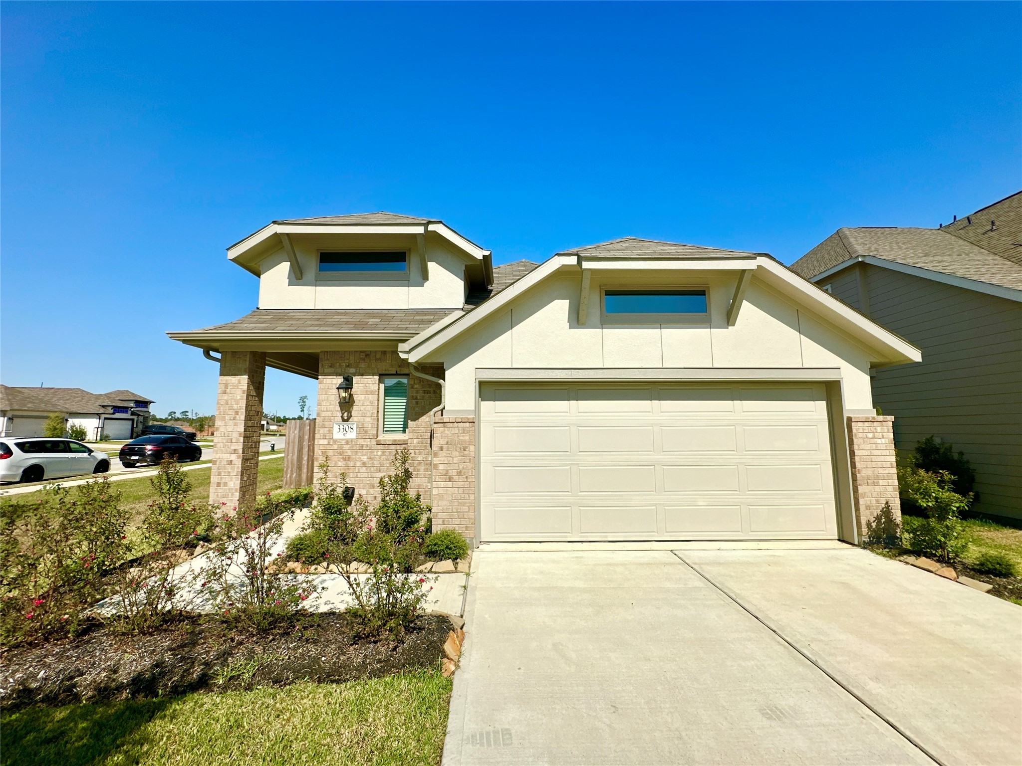 3308 Scarlet Tupelo Way Spring, TX 77386 - Photo 1 of 23 a front view of a house with a yard