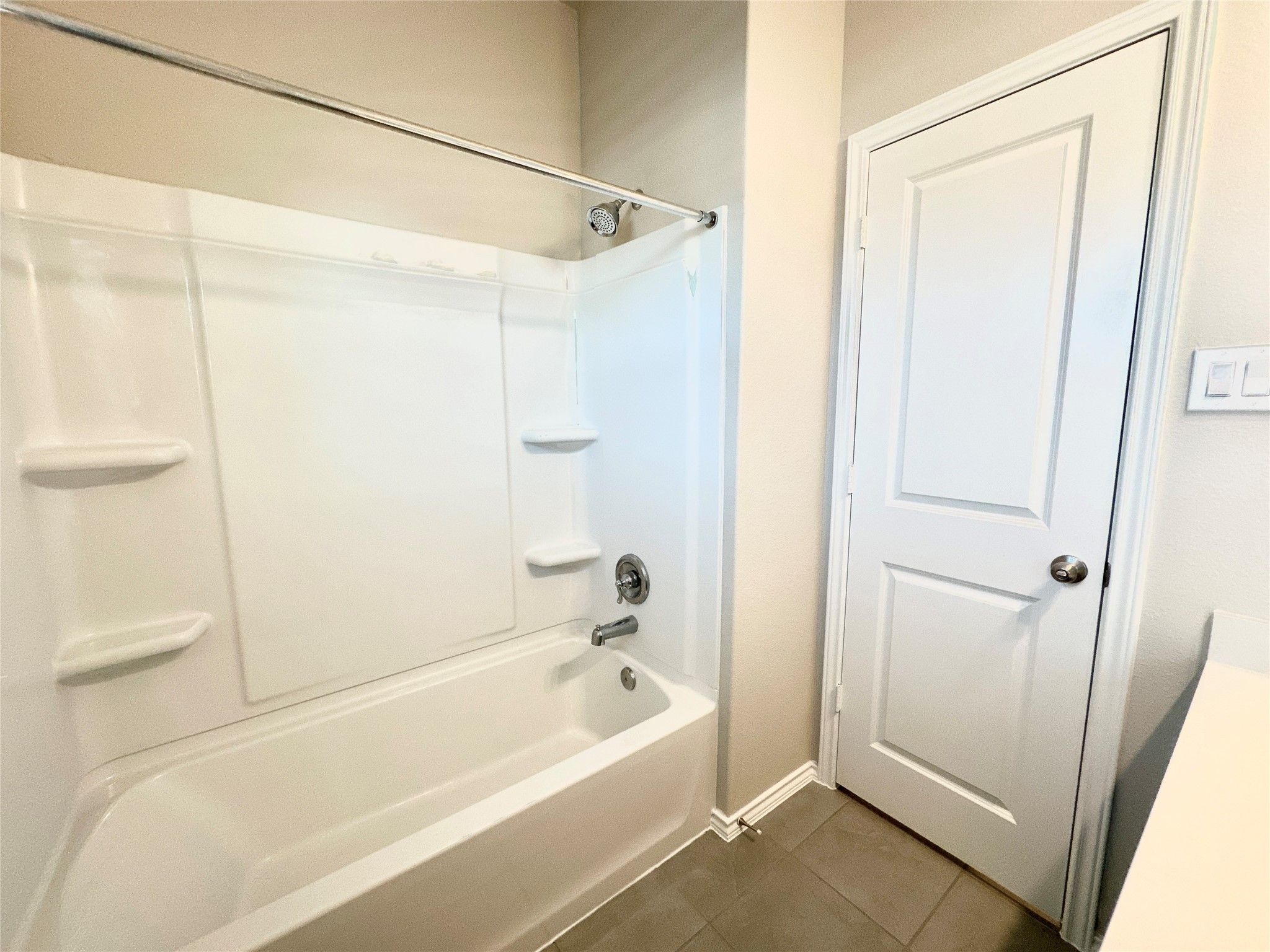 3308 Scarlet Tupelo Way Spring, TX 77386 - Photo 11 of 23 a bathroom with a bathtub and a shower