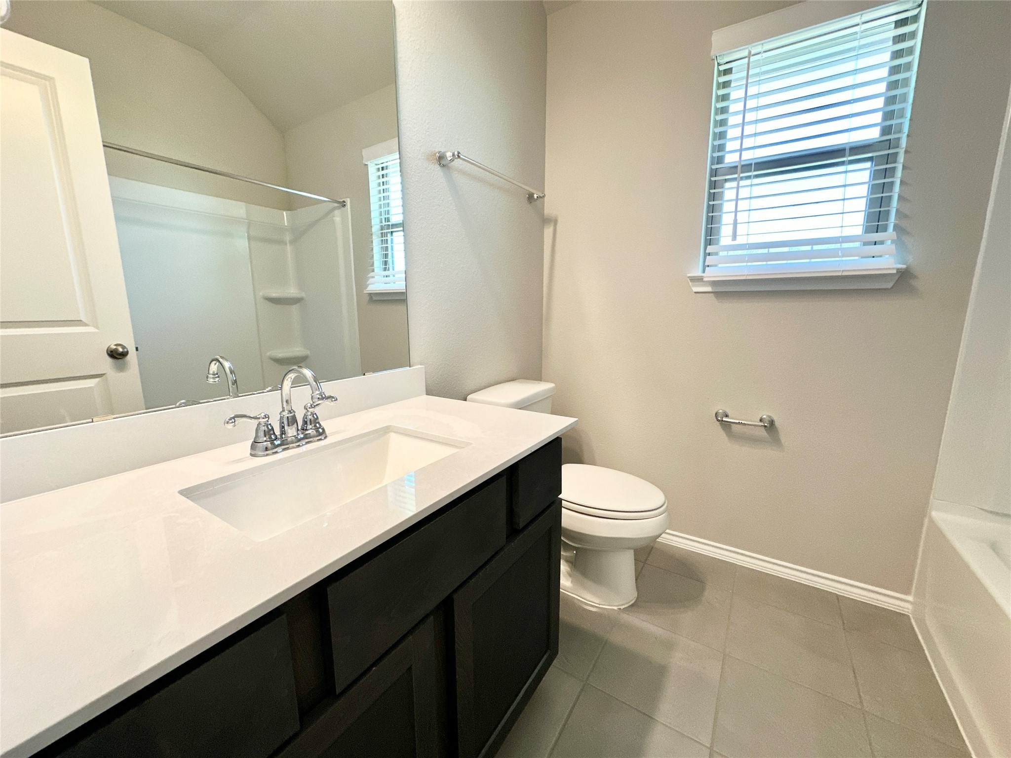 3308 Scarlet Tupelo Way Spring, TX 77386 - Photo 12 of 23 a bathroom with a sink a toilet and a mirror