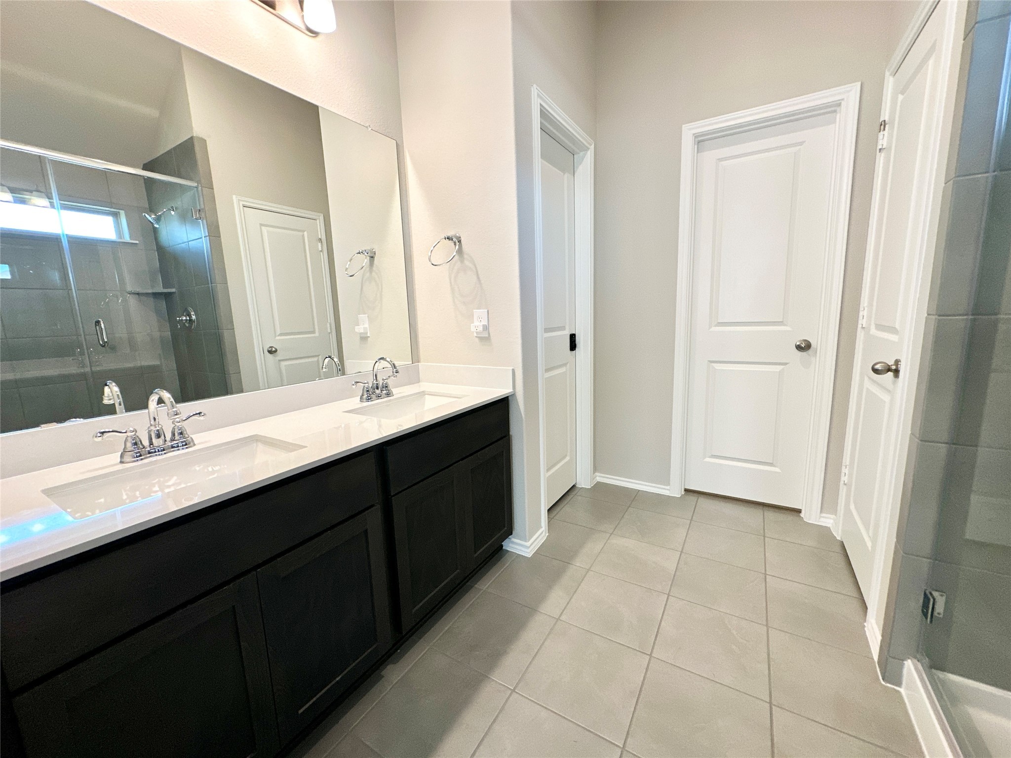 3308 Scarlet Tupelo Way Spring, TX 77386 - Photo 16 of 23 a bathroom with a double vanity sink a mirror and a