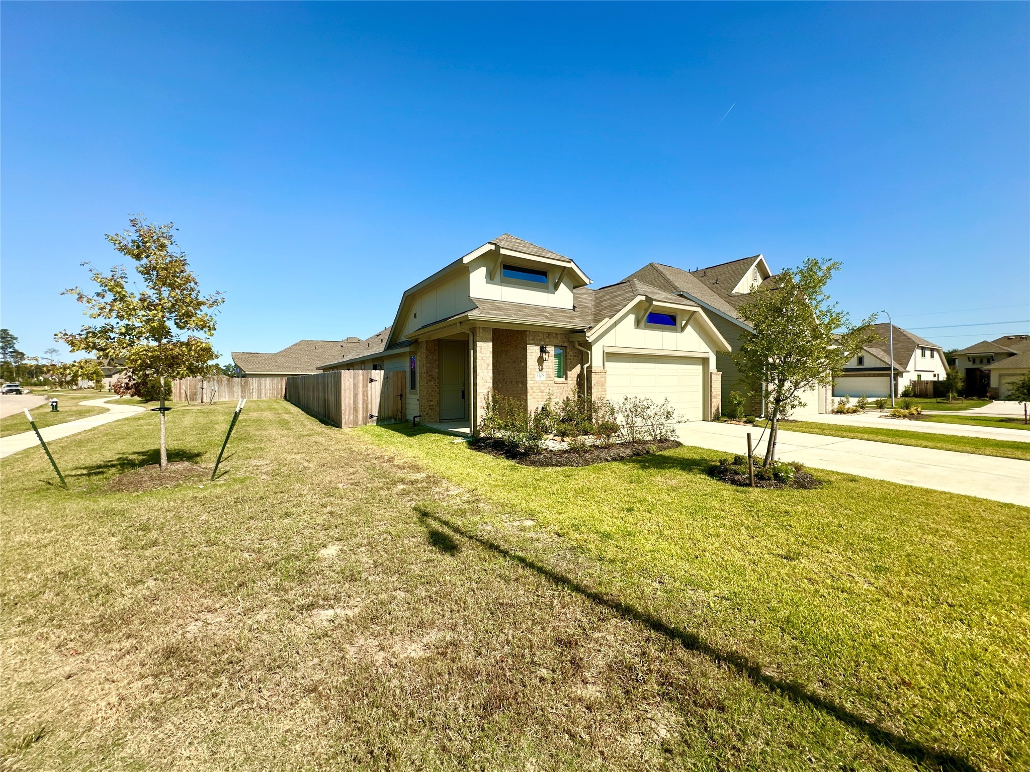 3308 Scarlet Tupelo Way Spring, TX 77386 - Photo 2 of 23 a front view of a house with a yard