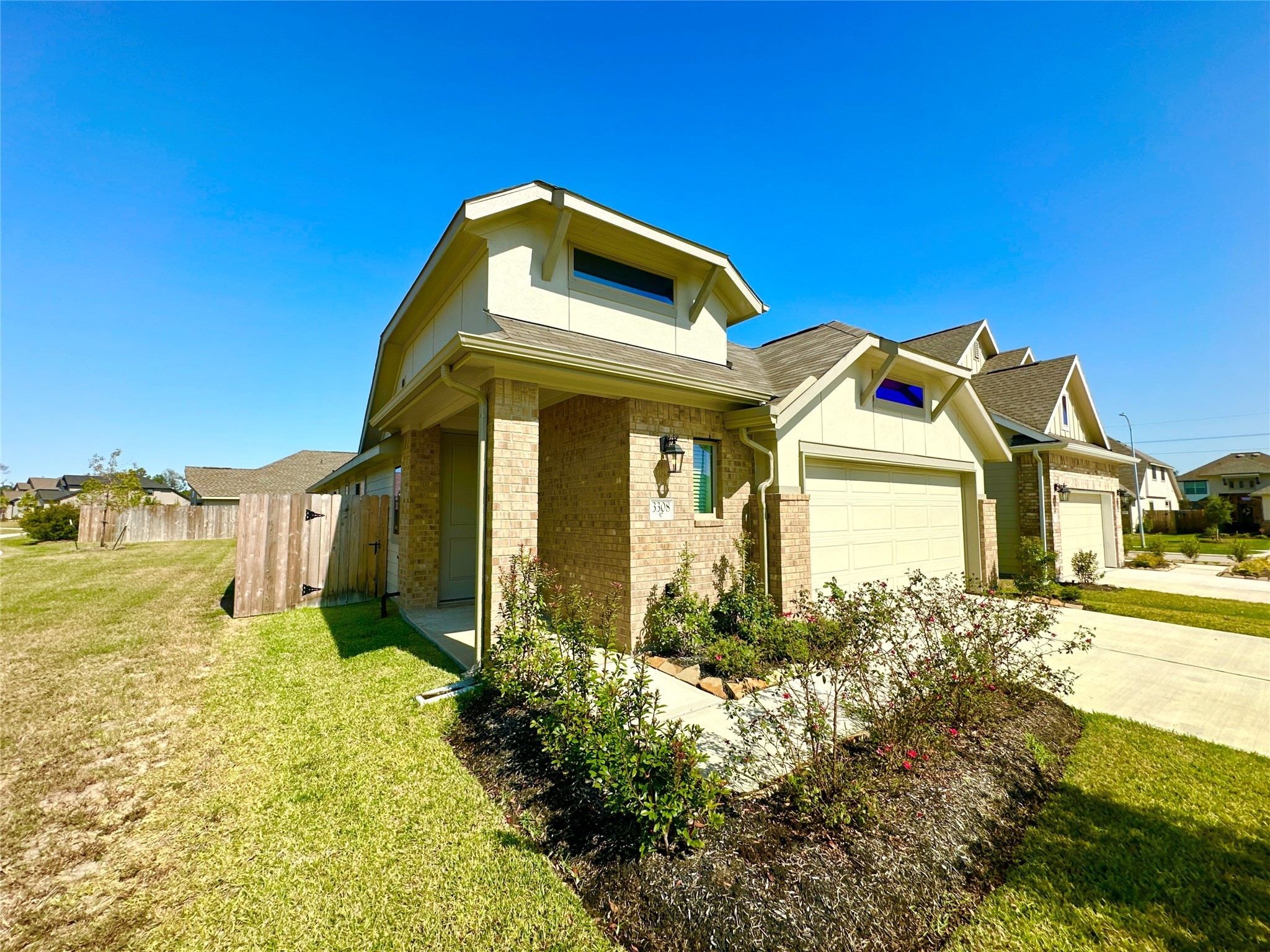 3308 Scarlet Tupelo Way Spring, TX 77386 - Photo 3 of 23 a front view of a house with a yard