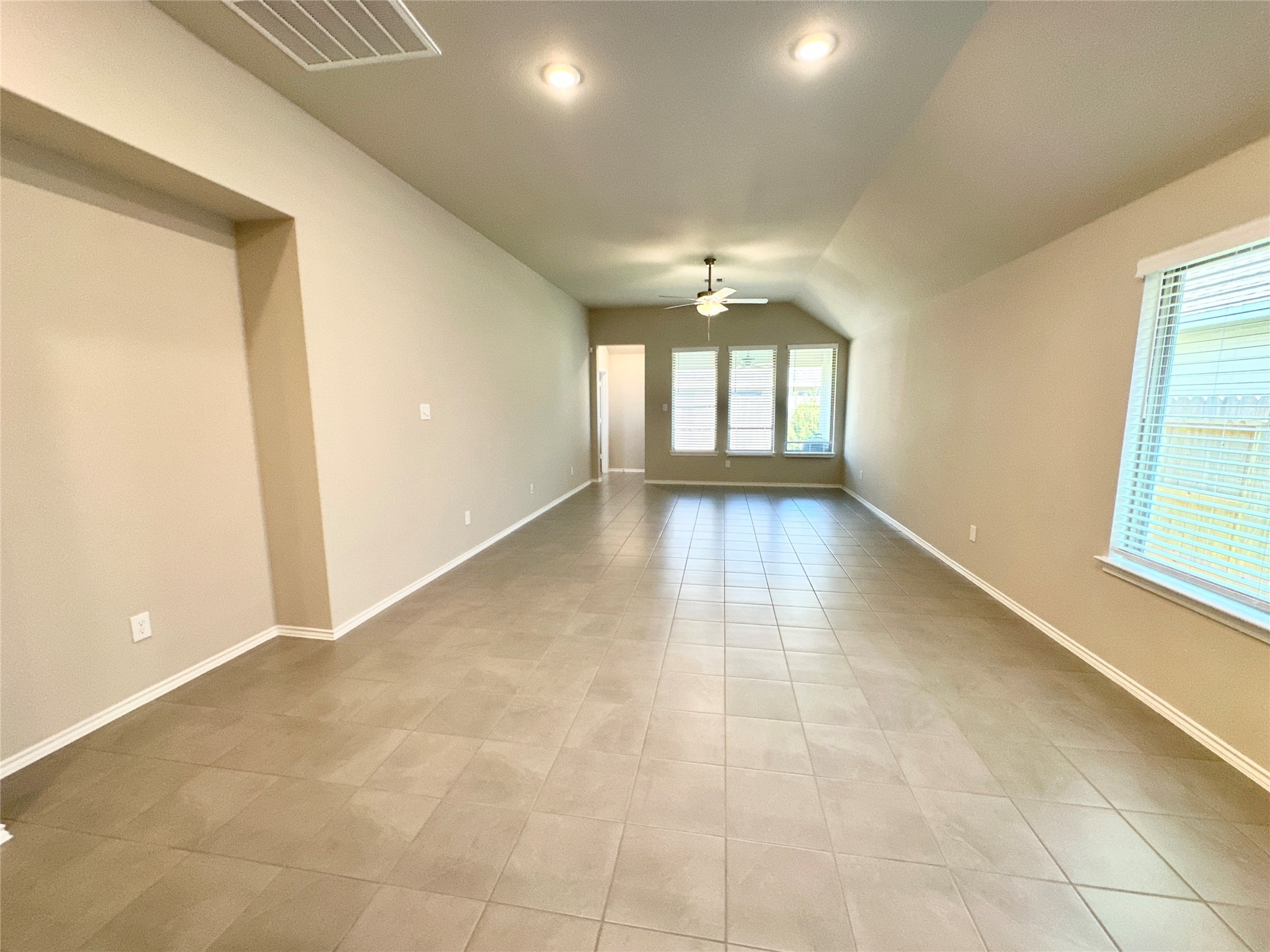 3308 Scarlet Tupelo Way Spring, TX 77386 - Photo 9 of 23 an empty room with windows and entrance