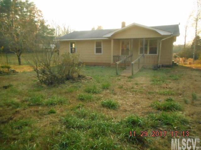 921 Engineer Road Bostic, NC 28018 - Photo 4 of 13 a front view of a house with a yard