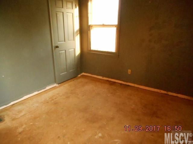 921 Engineer Road Bostic, NC 28018 - Photo 8 of 13 an empty room with windows