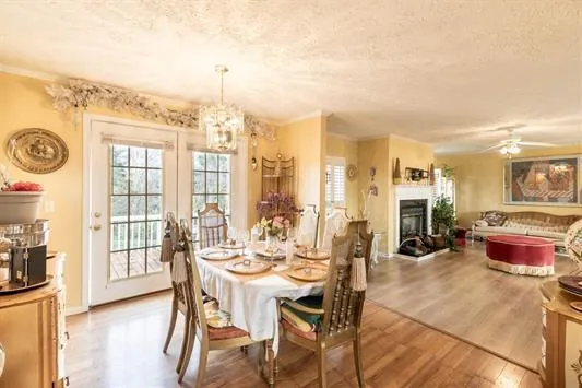 a kitchen with stainless steel appliances granite countertop a refrigerator sink stove and cabinets