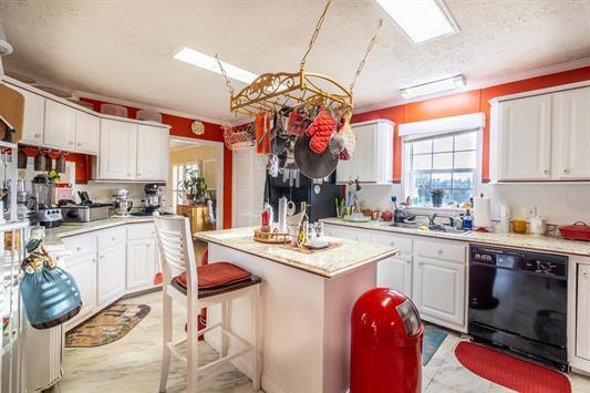 183 Smith Farm Road Northeast Check, VA 24072 - Photo 17 of 23 a kitchen with stainless steel appliances granite countertop a sink stove and cabinets