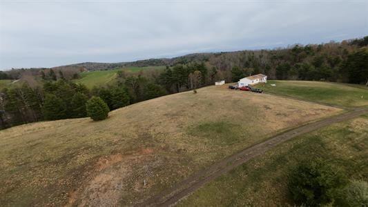 183 Smith Farm Road Northeast Check, VA 24072 - Photo 2 of 23 a view of a field with trees in the background