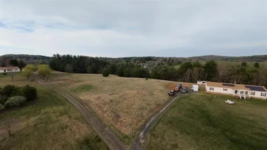 a view of a field with sitting area
