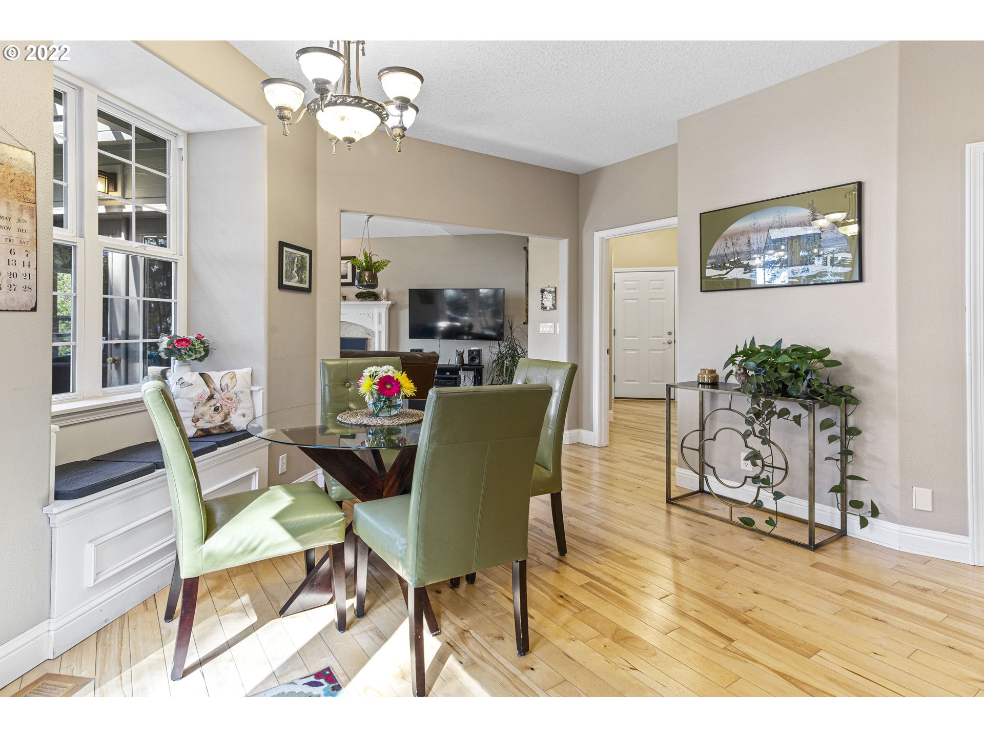 28501 Northeast 67th Street Camas, WA 98607 - Photo 16 of 32 a view of a dining room with furniture a chandelier and wooden floor