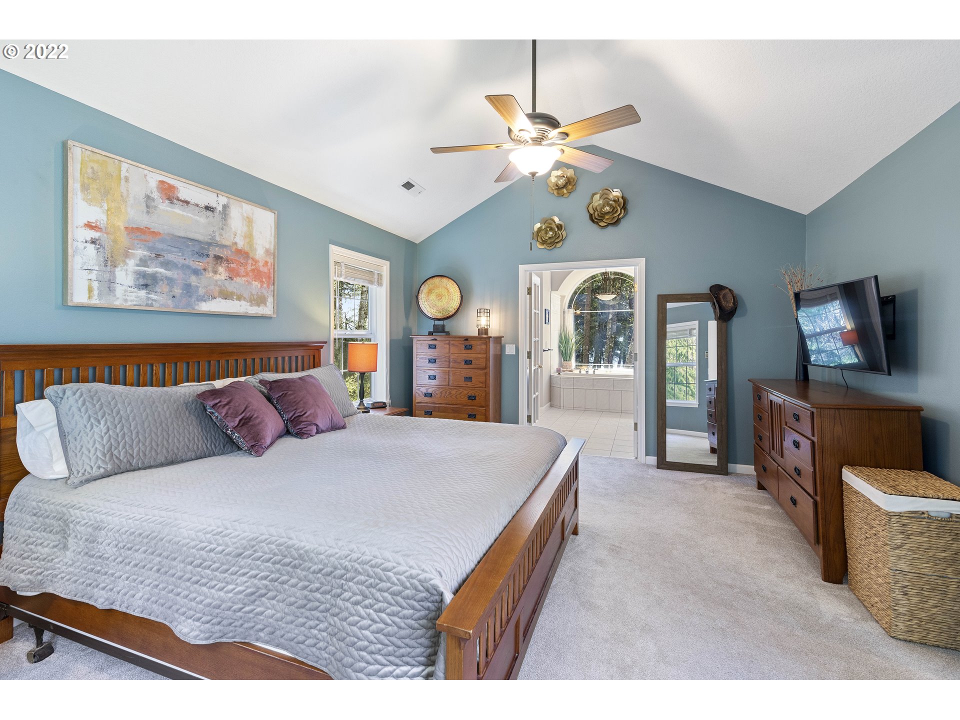 28501 Northeast 67th Street Camas, WA 98607 - Photo 21 of 32 a spacious bedroom with a bed and ceiling fan
