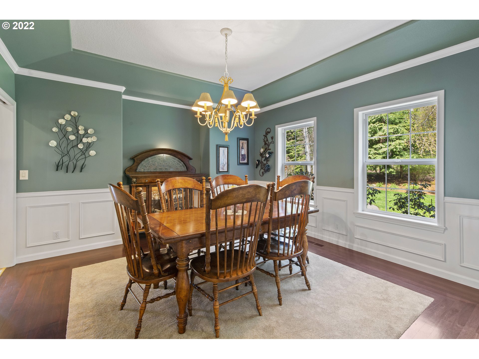 28501 Northeast 67th Street Camas, WA 98607 - Photo 8 of 32 a dining room with furniture a chandelier and wooden floor
