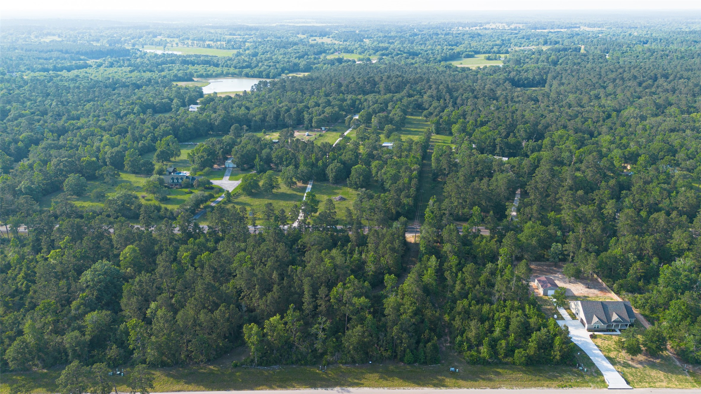 333 Iron Horse Road Willis, TX 77378 - Photo 9 of 15 an aerial view of residential houses with outdoor space and trees