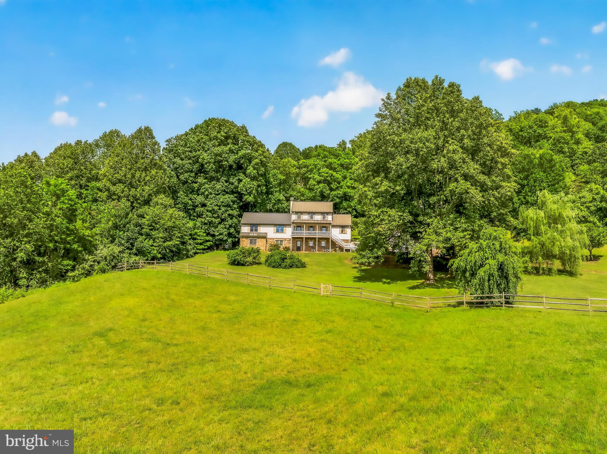 4028 South F T Valley Road Etlan, VA 22719 - Photo 94 of 101 a view of a big yard with swimming pool and green space