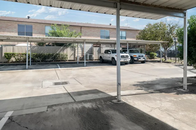 a view of a house with pool and sitting area