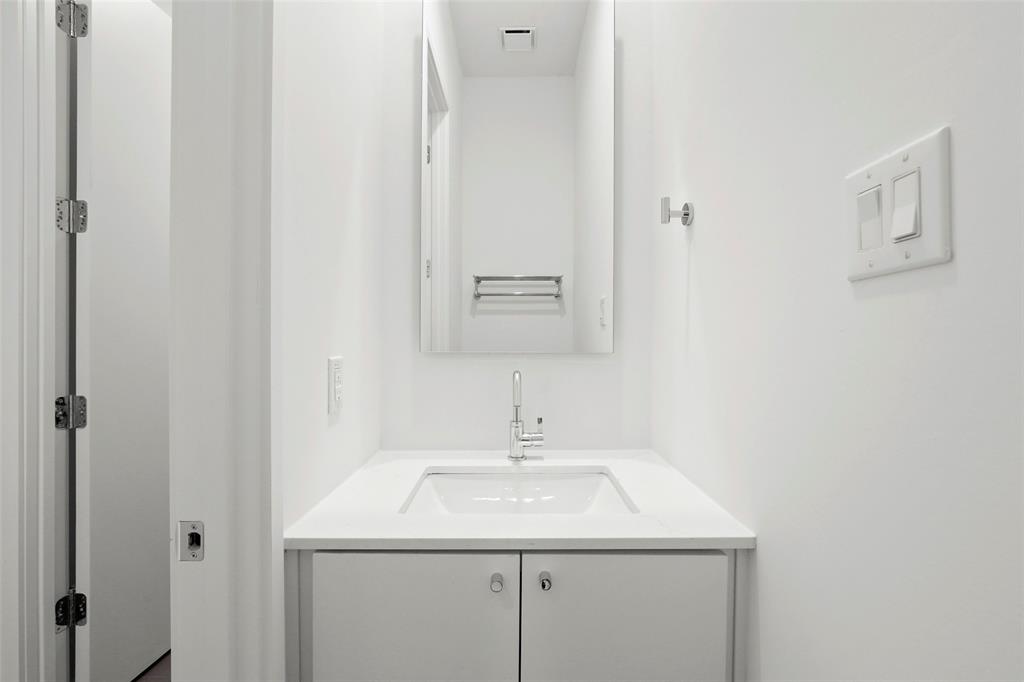 6250 Oram Street, Unit 102 Dallas, TX 75214 - Photo 16 of 21 a bathroom with a sink and a mirror
