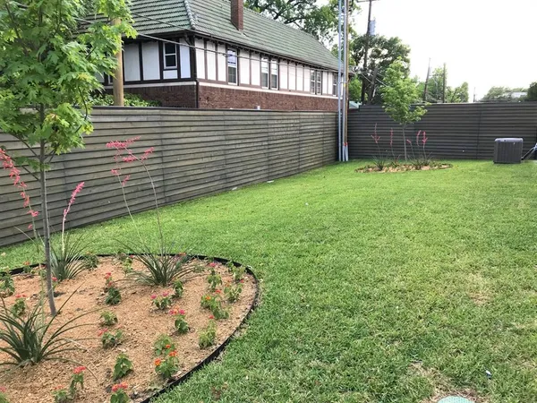 a view of a backyard with a garden