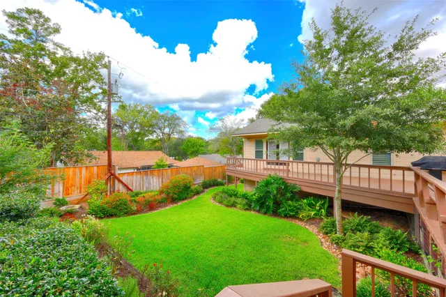 a view of a garden with deck