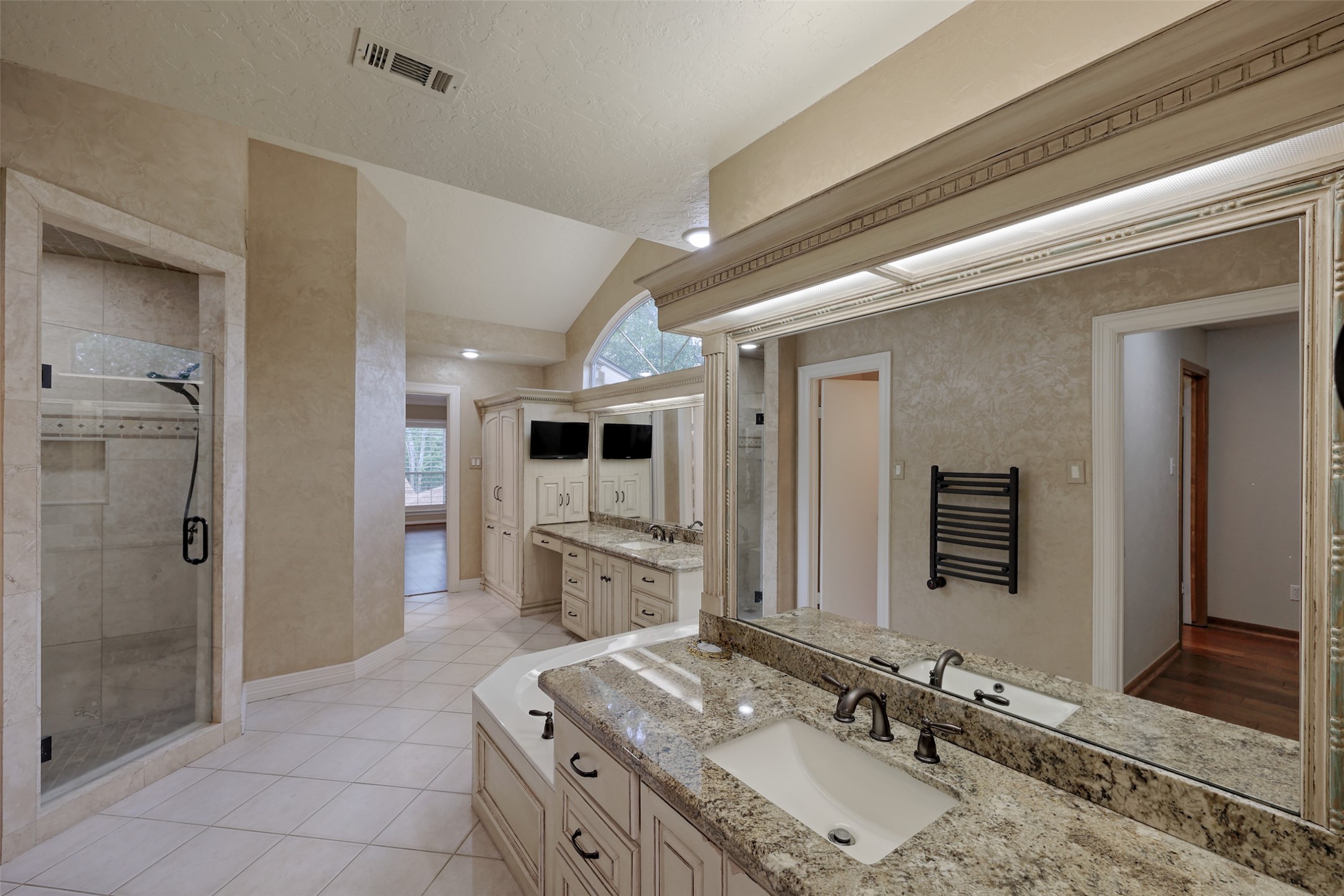 206 Virginia Lane Conroe, TX 77304 - Photo 21 of 36 a bathroom with a granite countertop sink mirror and shower