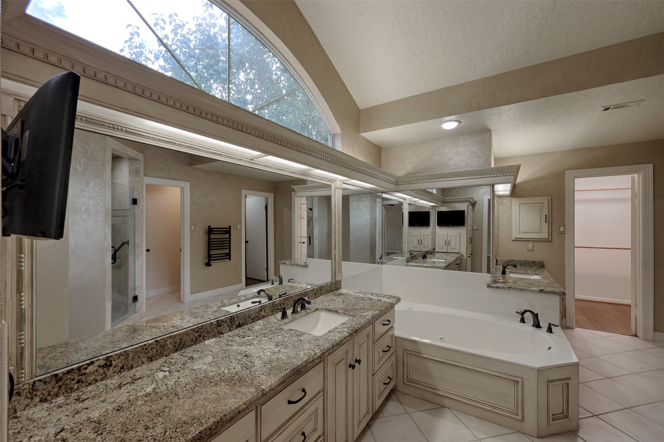 206 Virginia Lane Conroe, TX 77304 - Photo 22 of 36 a bathroom with a tub sink and mirror