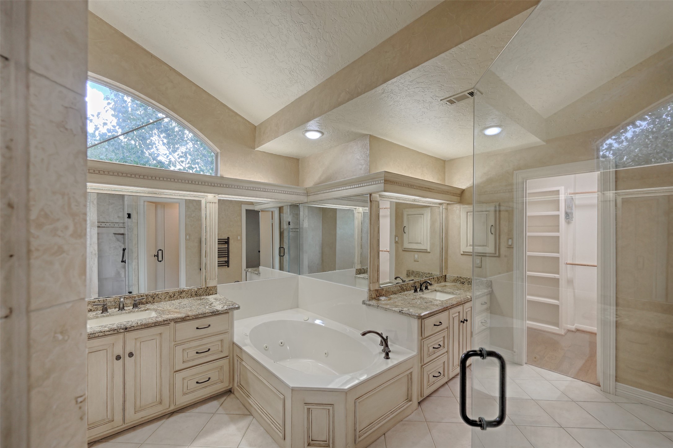206 Virginia Lane Conroe, TX 77304 - Photo 23 of 36 a bathroom with a granite countertop sink mirror and shower