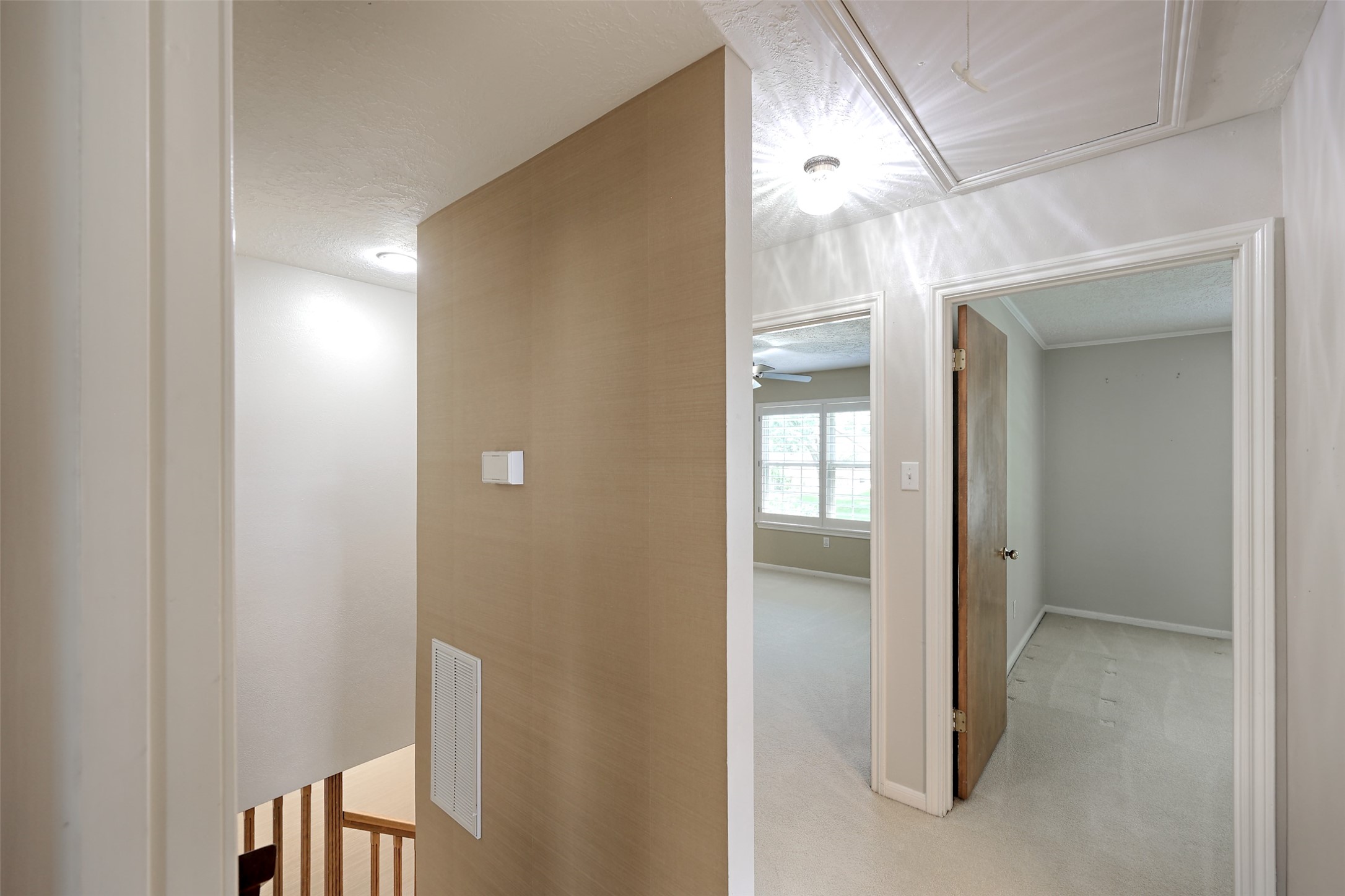206 Virginia Lane Conroe, TX 77304 - Photo 24 of 36 a view of a hallway with wooden shelves