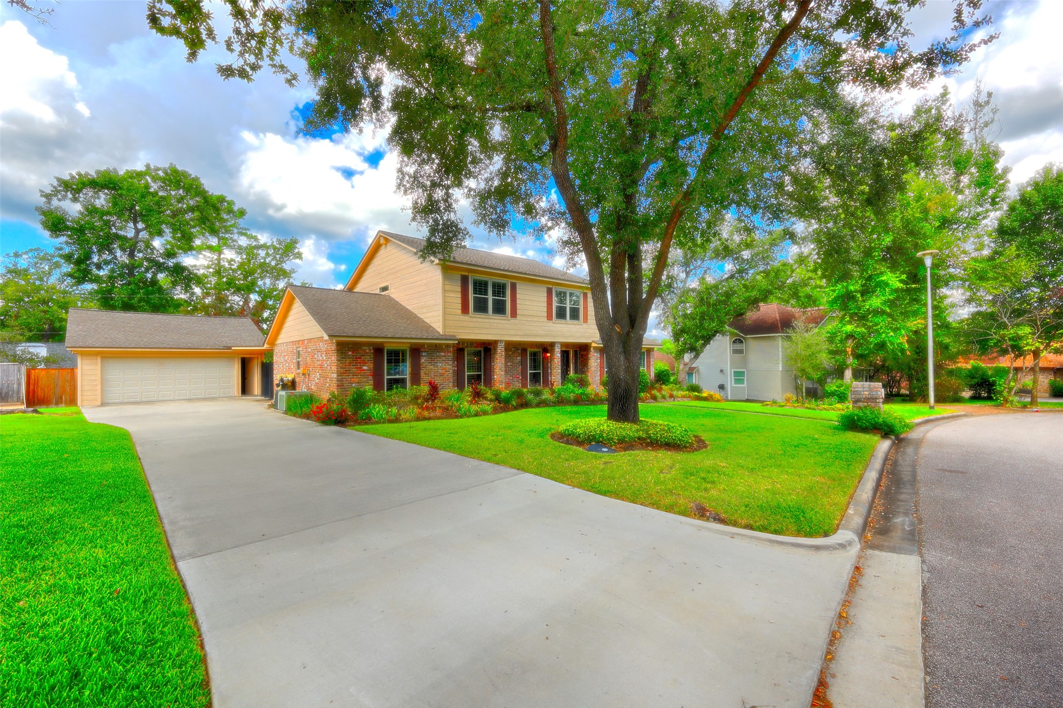 206 Virginia Lane Conroe, TX 77304 - Photo 4 of 36 a front view of a house with a yard and potted plants
