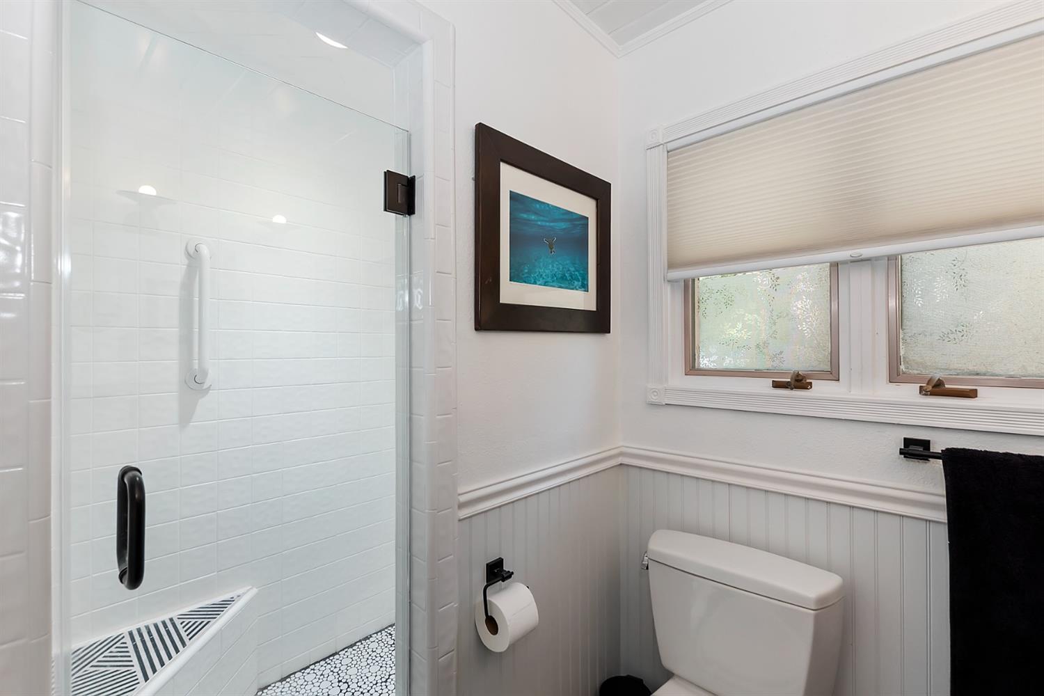 28277 Arbon Lane Lake Arrowhead, CA 92352 - Photo 28 of 50 a bathroom with a toilet a sink a window and mirror